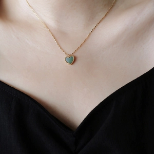 French vintage 18K gold plated heart necklace with green stone inlay on model