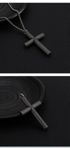 Detail of cross pendant with diamond knurling texture on stainless steel chain
