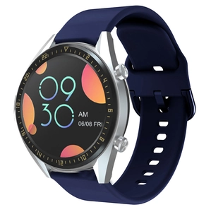 Detail shot of silver smartwatch featuring a dark blue silicone strap and round display