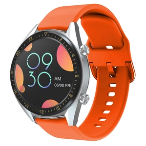 Detail of smart watch with vibrant orange silicone strap and 46mm silver metal case