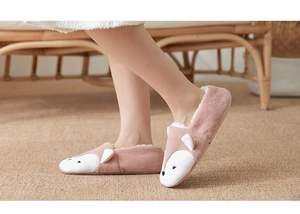 Close-up of pink fox coral fleece slipper socks with white plush lining and 3D ears