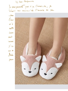 Detail of pink fox slippers with soft plush fabric and thick warm fleece lining