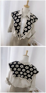 Detailed front and back view of a black knitted shawl with floral patterns and a wide collar