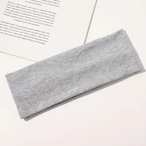 Detailed texture of light grey ribbed knit headband for yoga and daily use