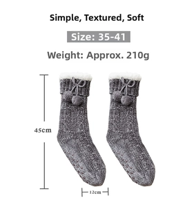 Close-up of thick thermal floor socks with faux fur trim, bows and anti-slip rubber soles