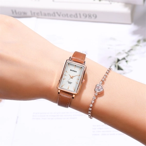 Rectangle rose gold quartz watch with brown leather strap and delicate heart bracelet