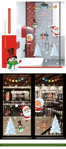 Detail of Christmas Santa and Snowman stickers applied to glass doors and shop windows
