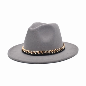 Dark grey wool fedora hat with flat brim and gold chain band decoration on white background