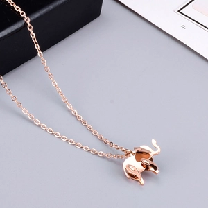 Rose gold elephant pendant necklace with polished finish on a delicate cable chain