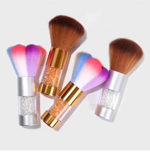 Detailed view of four nail dust brushes with acrylic handles and colorful fiber bristles