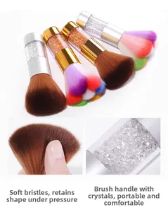 Detail showing soft fiber nail dust brush with rainbow bristles and rhinestone handle