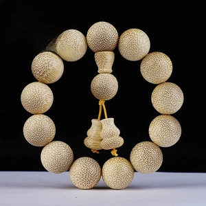 Macro view of 18mm Dragon Blood Golden Bamboo beads with natural fiber texture