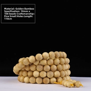 Macro shot of 10mm 108 golden silk bamboo beads with precision small hole craftsmanship