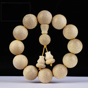 Detailed view of 20mm dragon blood bamboo prayer beads with unique speckled grain
