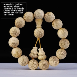 Detailed macro of 15mm golden silk bamboo prayer beads with natural fish-egg textures