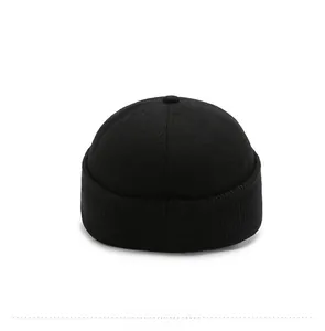 Macro view of black wool winter hat showing premium fiber texture and back details