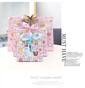 Three-piece pink unicorn gift bag set with colorful ribbons and cartoon rainbow patterns