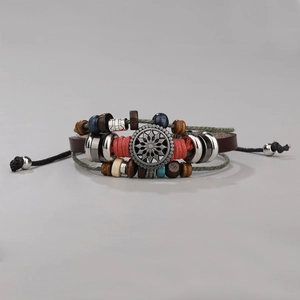 Close-up of bohemian multilayer leather bracelet with ethnic beads and turquoise detail