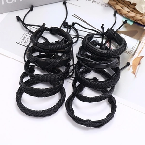 Set of 6 black braided leather bracelets with adjustable cords for casual wear