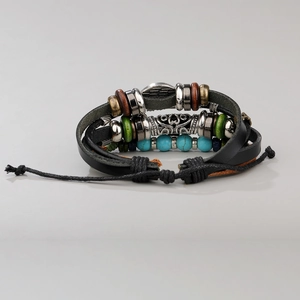 Detail of multi-layer leather bracelet with turquoise beads and sun flower metal charm