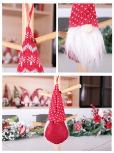 Close-up of red knitted Christmas gnome hanging ornament showing fabric texture and faux fur