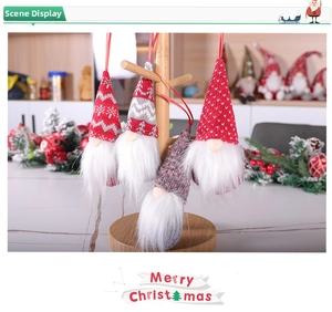 Close-up of Nordic knitted Christmas gnome ornaments with red snowflake patterns