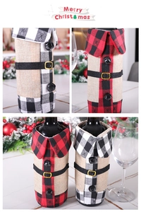 Close-up of red and black plaid wine bottle cover with belt and bell holiday decor