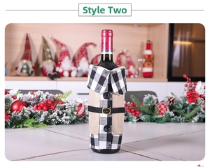 Close-up of red and black checkered wine bottle cover with a collar and decorative belt