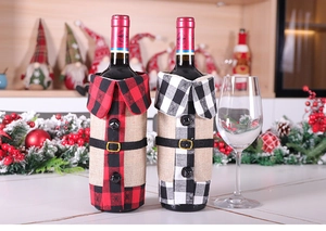 Close-up of plaid Christmas wine bottle covers with collars and decorative belt buckles