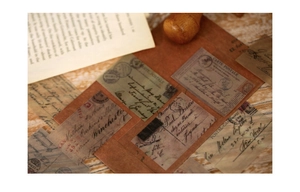 Macro detail of vintage floral botanical stickers with handwritten script and retro stamps