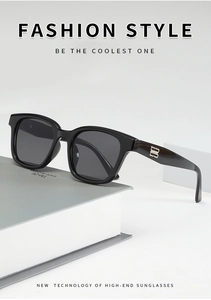 Detail of glossy black square sunglasses frame and silver metal temple decoration