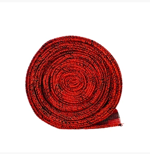 Close-up of red and black checkered ribbon roll for Christmas decoration and crafts