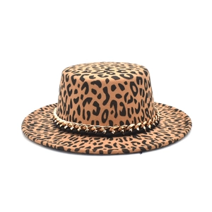 Fashionable leopard print flat top wool fedora with gold chain trim on white background