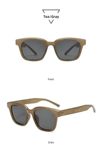 Detail view of tea-colored square sunglasses frame with Trend & Fashion side lettering