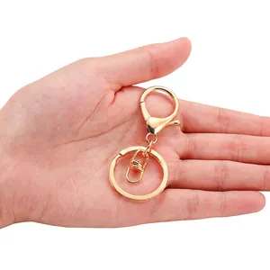 Polished gold alloy lobster clasp keyring set with flat split ring and swivel hook
