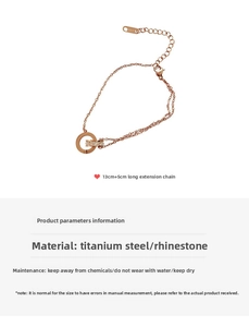 Detail of rose gold titanium steel bracelet with rhinestone double rings and chain