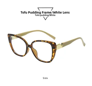 Detail of square cat-eye frame with gold V-hinge decoration and tortoiseshell pattern