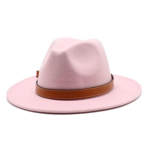 Detail of pink fedora hat with brown faux leather band and visible white stitching