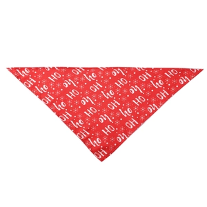 Detailed flat lay of a red Christmas dog bandana with white snow and HO HO HO prints
