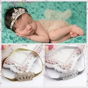 Detailed view of baby crown headband with rhinestones in gold and silver finish