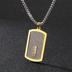 Minimalist gold and silver two-tone dog tag necklace with inlaid zircons on frosted pendant