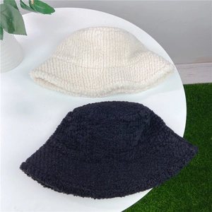 Black and beige twill lamb wool bucket hats for women in a warm winter style