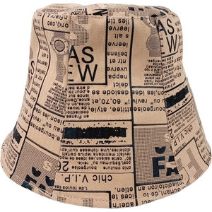 Retro apricot bucket hat with black newspaper print pattern for a chic street style