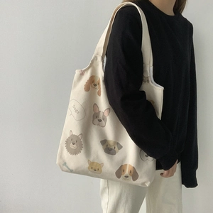 Detail of dog illustration tote bag showing high-quality canvas and cute canine prints