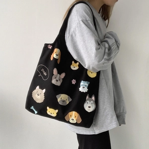 Black canvas tote bag featuring various cartoon dog breeds and large capacity shoulder strap
