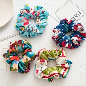 Set of 4 Christmas velvet hair scrunchies with festive Santa and snowman patterns