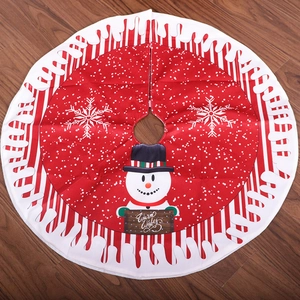 80cm Christmas tree skirt with snowman pattern and Warm Wishes text on wood floor