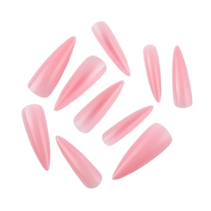 Detailed close-up of glossy pink stiletto artificial nails in various sizes for extensions