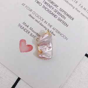 Detailed view of pink baroque pearl pendant with gold plating for DIY jewelry making