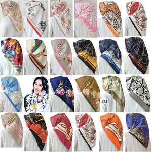 Detailed grid view showcasing 24 different satin scarf patterns with chain and floral prints